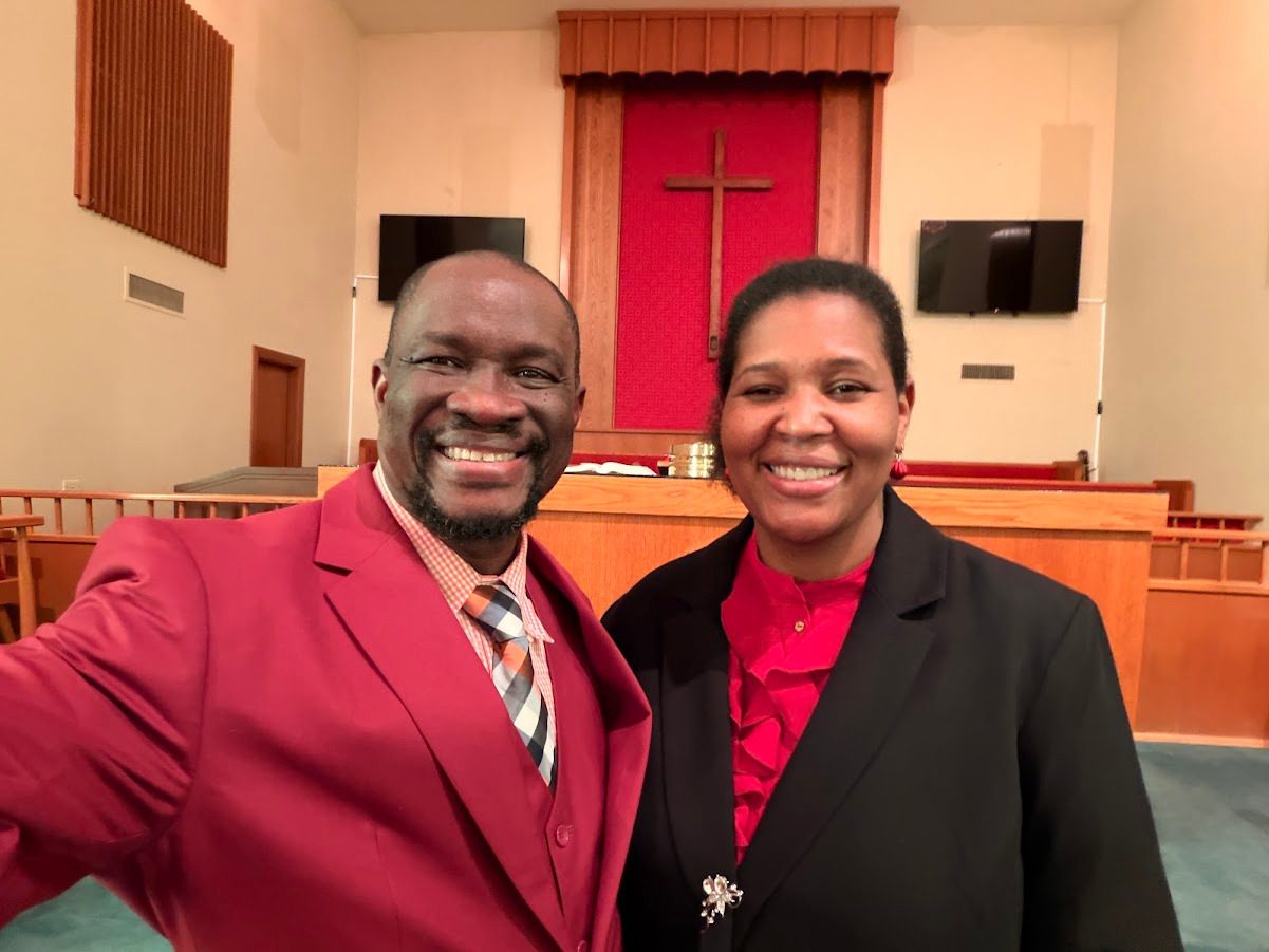 Pastor Jean Jacob Jeudy and Sister Rachelle Jeudy in the sanctuary of The Bridge